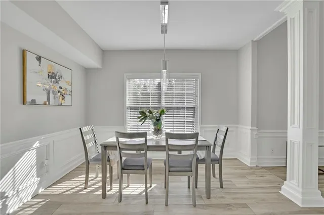 a view of a dining room with furniture window and outside view