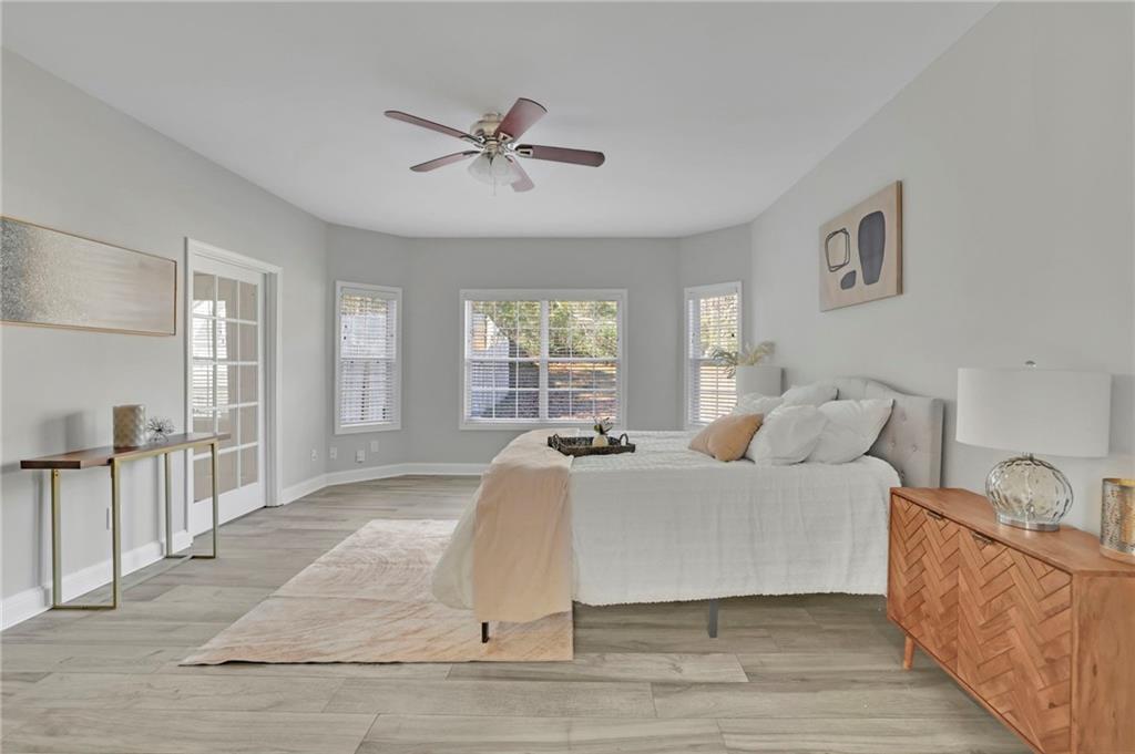 5696 Kilrush Court Mableton, GA 30126 - Photo 19 of 46 a living room with a bed furniture and a large window