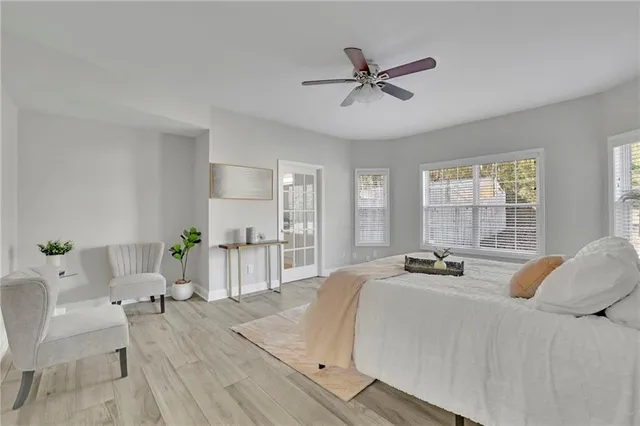 a bedroom with a bed and a chair