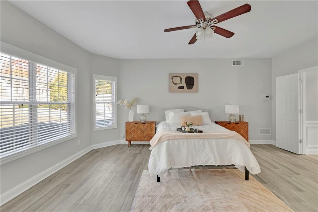 5696 Kilrush Court Mableton, GA 30126 - Photo 22 of 46 a bedroom with a bed and wooden floor