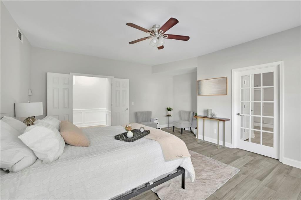 5696 Kilrush Court Mableton, GA 30126 - Photo 23 of 46 a bedroom with a bed and a large window with the outer view