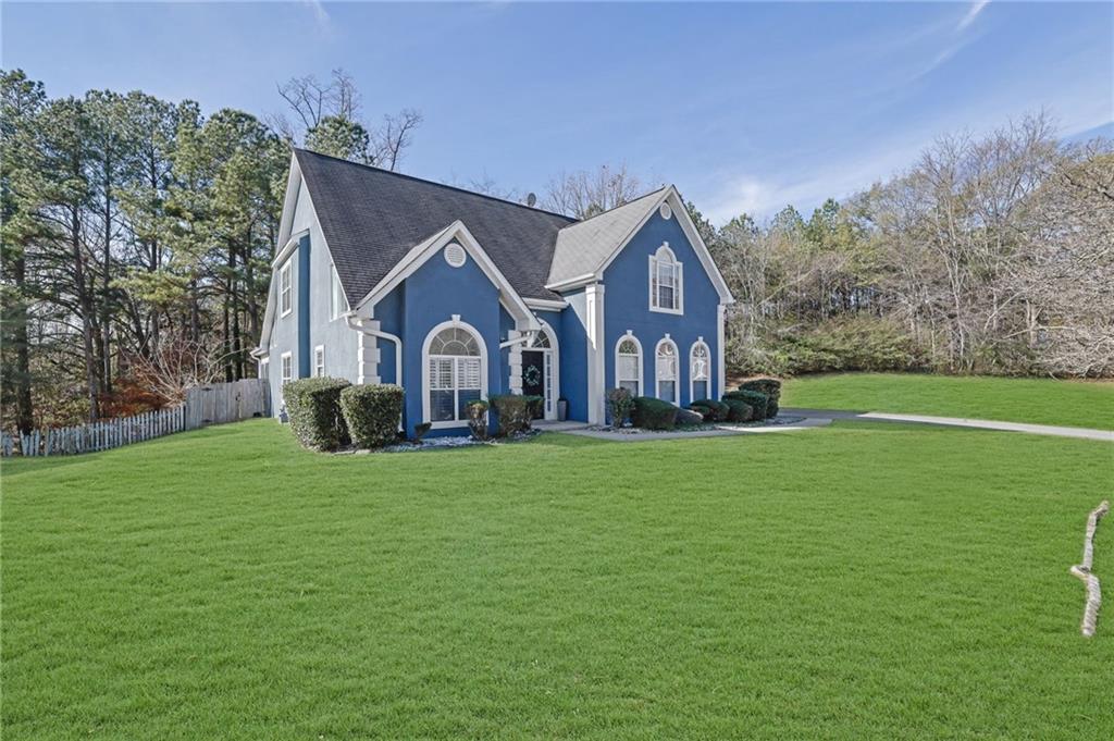5696 Kilrush Court Mableton, GA 30126 - Photo 3 of 46 a front view of a house with garden
