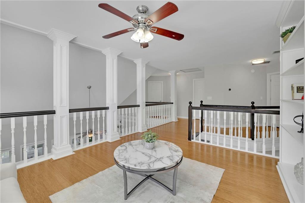 5696 Kilrush Court Mableton, GA 30126 - Photo 32 of 46 a living room with wooden floor and a table