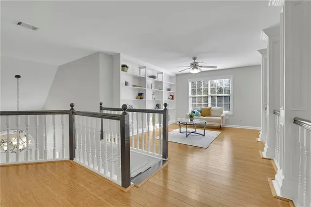 a view of a livingroom with furniture and a window