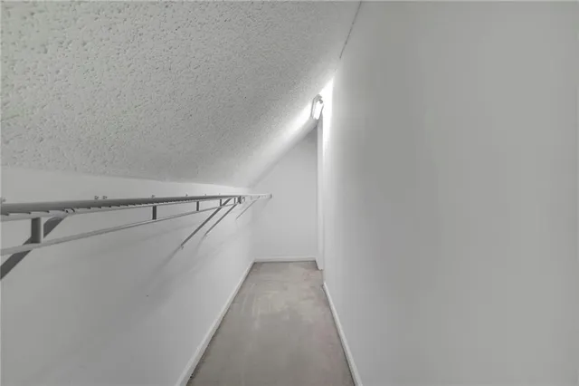 a view of a hallway with stairs