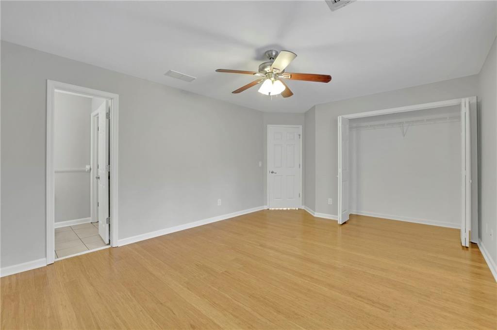 5696 Kilrush Court Mableton, GA 30126 - Photo 41 of 46 a view of an empty room with a chandelier fan