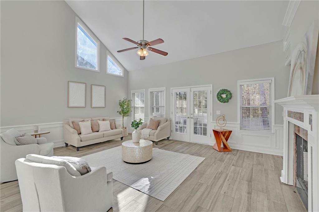 5696 Kilrush Court Mableton, GA 30126 - Photo 6 of 46 a living room with furniture a fireplace and a table