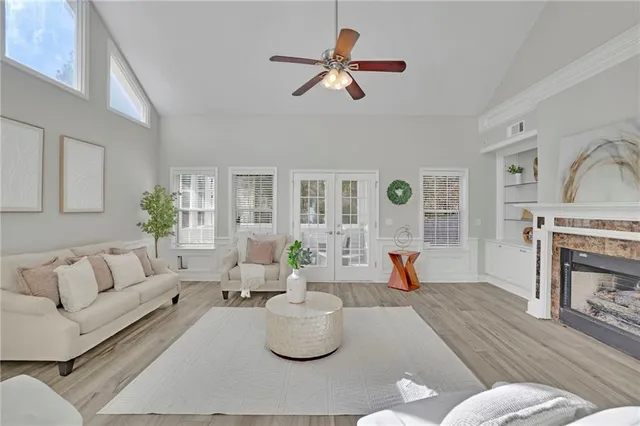 a living room with furniture and a fireplace