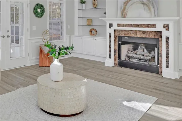 a living room with furniture and a fireplace