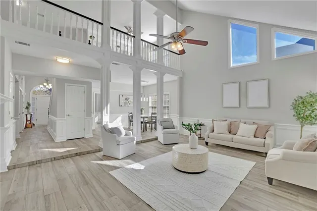 a living room with fireplace furniture and a wooden floor