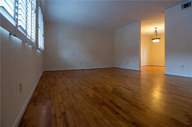 a view of wooden floor and brick walls
