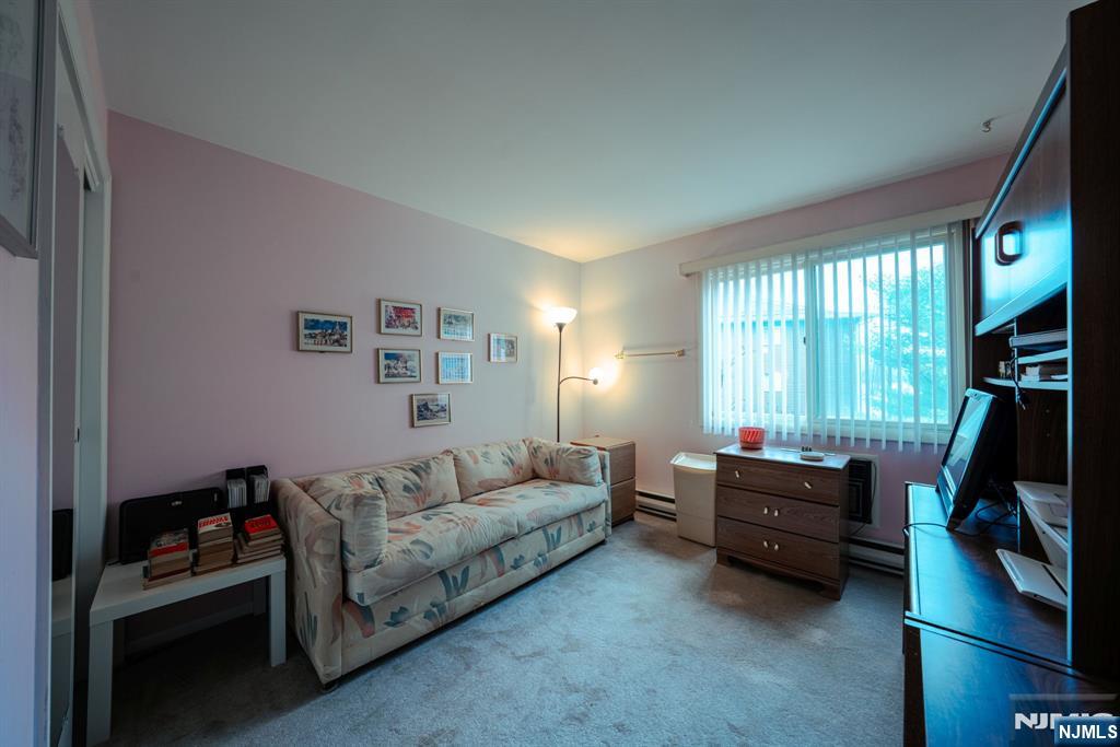 208 Federal Hill Road Pompton Lakes, NJ 07442 - Photo 15 of 22 a living room with furniture and a flat screen tv