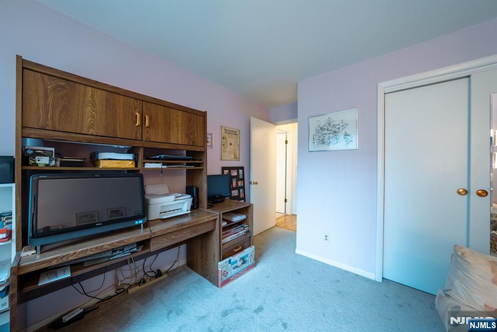 208 Federal Hill Road Pompton Lakes, NJ 07442 - Photo 16 of 22 a room with furniture and flat screen tv