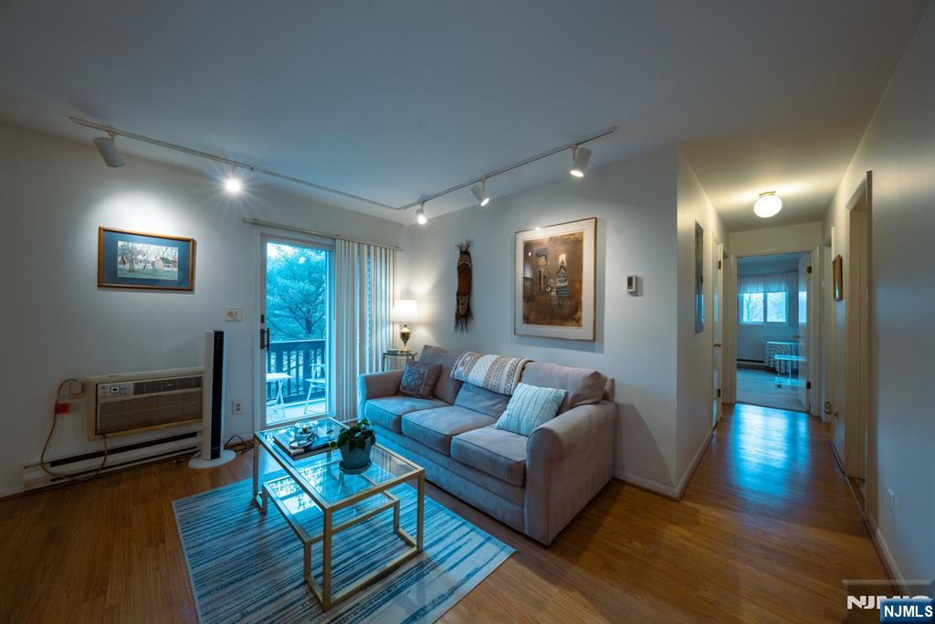 208 Federal Hill Road Pompton Lakes, NJ 07442 - Photo 3 of 22 a living room with furniture and a wooden floor