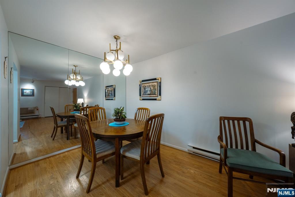 208 Federal Hill Road Pompton Lakes, NJ 07442 - Photo 7 of 22 a view of a dining room with furniture and wooden floor