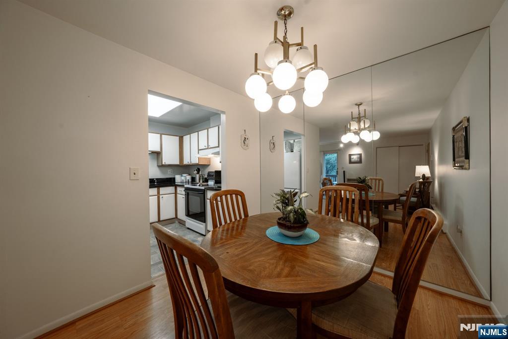 208 Federal Hill Road Pompton Lakes, NJ 07442 - Photo 8 of 22 a view of a dining room with furniture and wooden floor