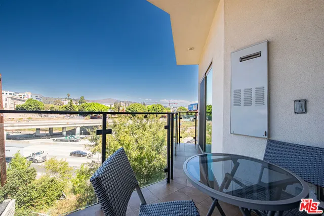 a view of balcony with furniture
