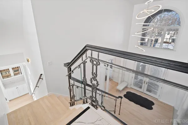 a view of staircase with white walls and a window