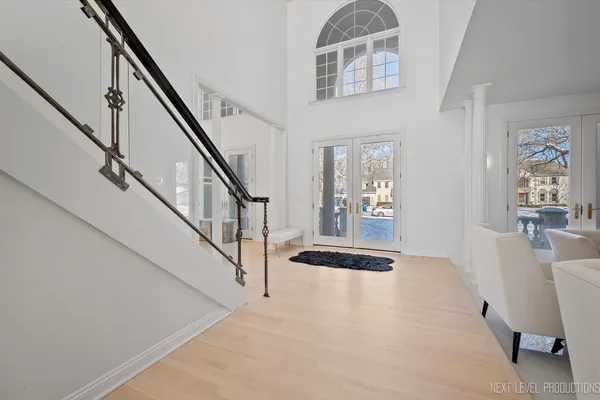 a view of an entryway with wooden floor