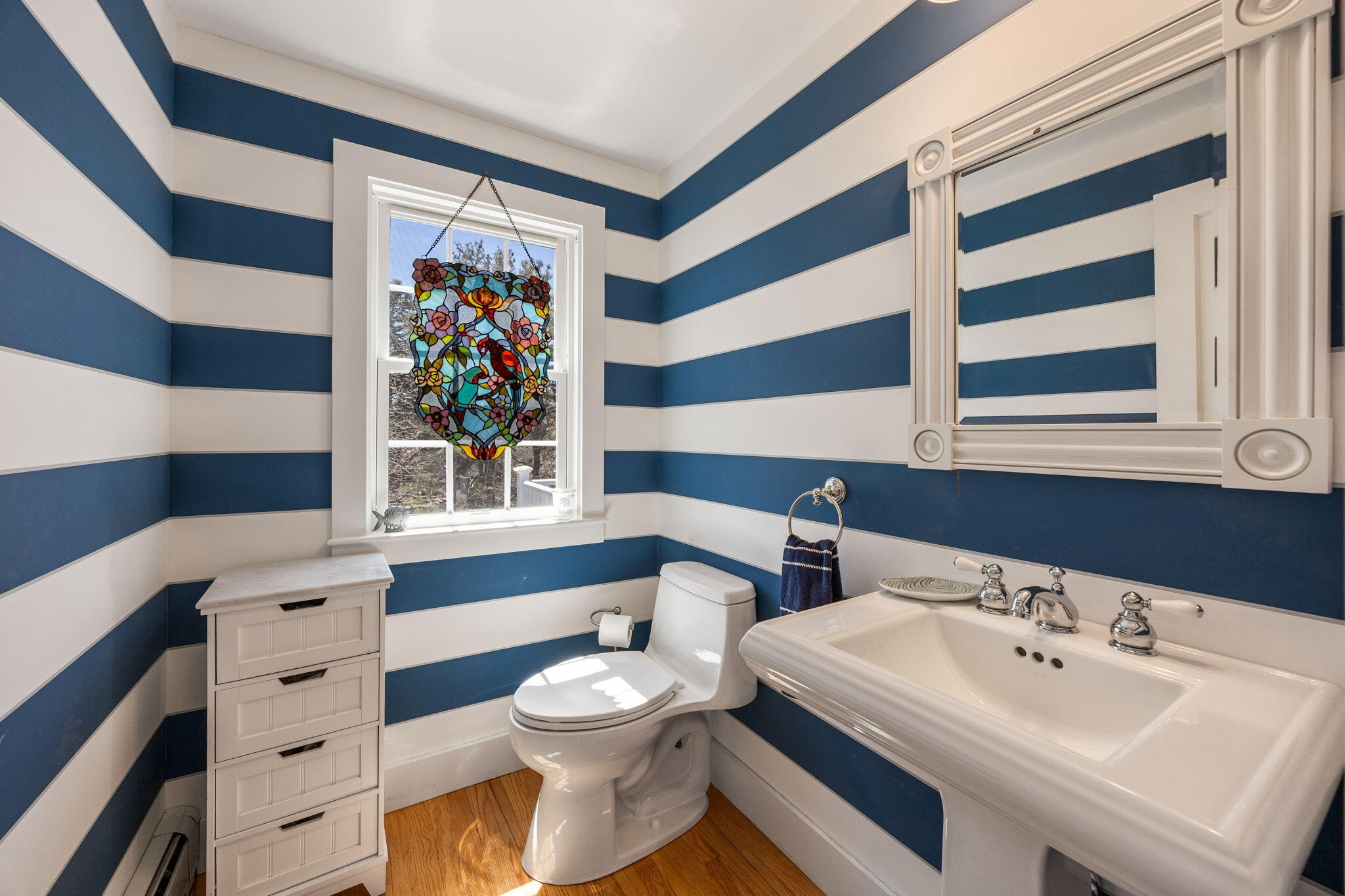 58 Stepping Stones Road Chatham, MA 02633 - Photo 17 of 52 a bathroom with a sink a toilet and a shower curtain
