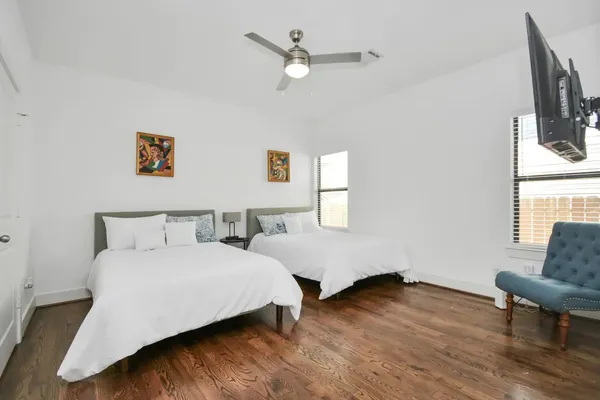 a bedroom with bed and window