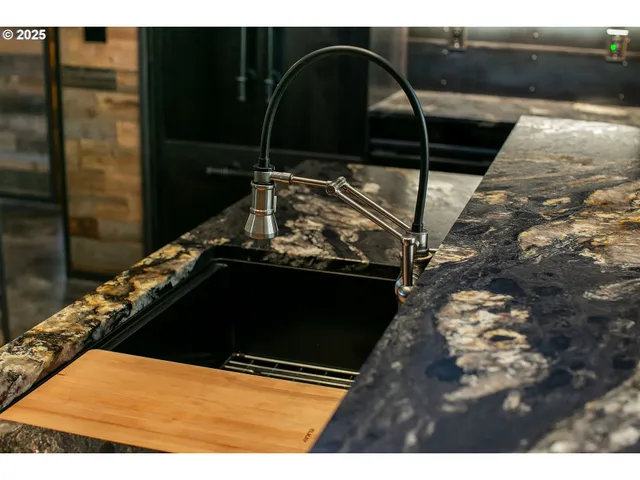 a black white and black black white kitchen with a stove