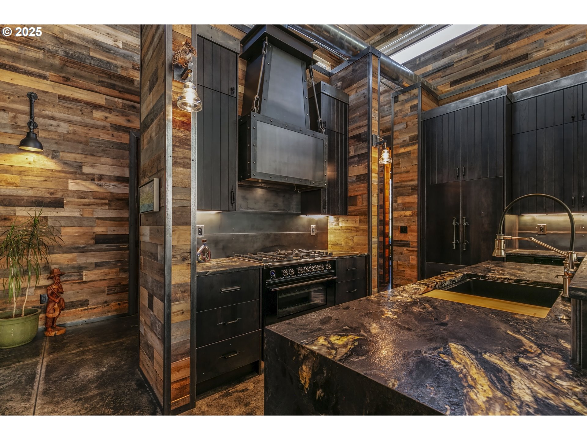 19476 Southwest Century Drive Bend, OR 97702 - Photo 16 of 44 a kitchen with kitchen island granite countertop a stove and a refrigerator