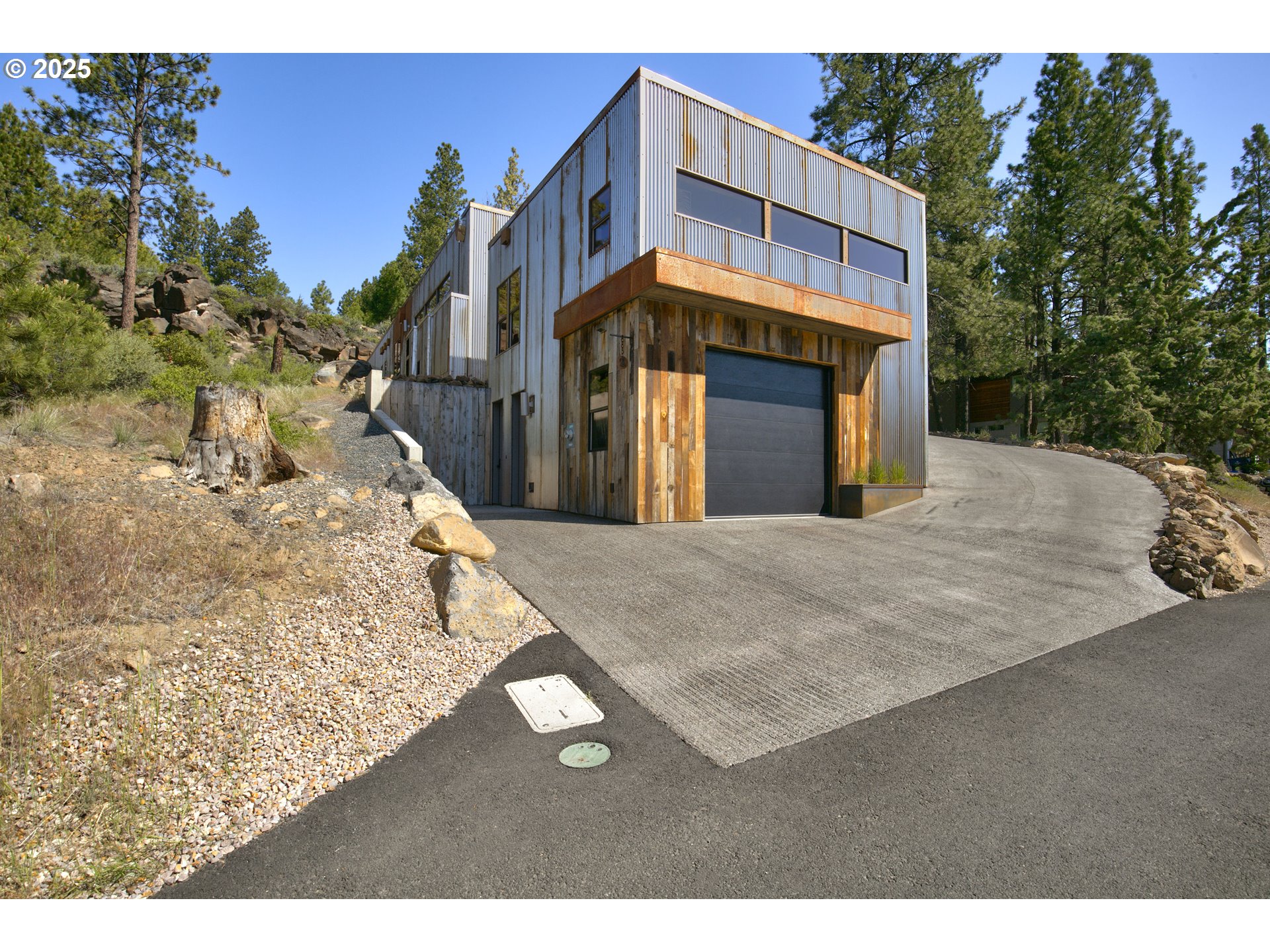 19476 Southwest Century Drive Bend, OR 97702 - Photo 33 of 44 a view of a house with a snow in the background