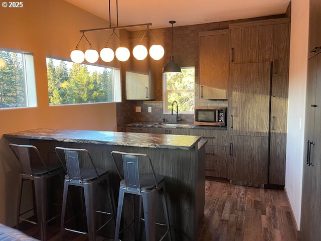 19476 Southwest Century Drive Bend, OR 97702 - Photo 37 of 44 a kitchen with a table chairs and window