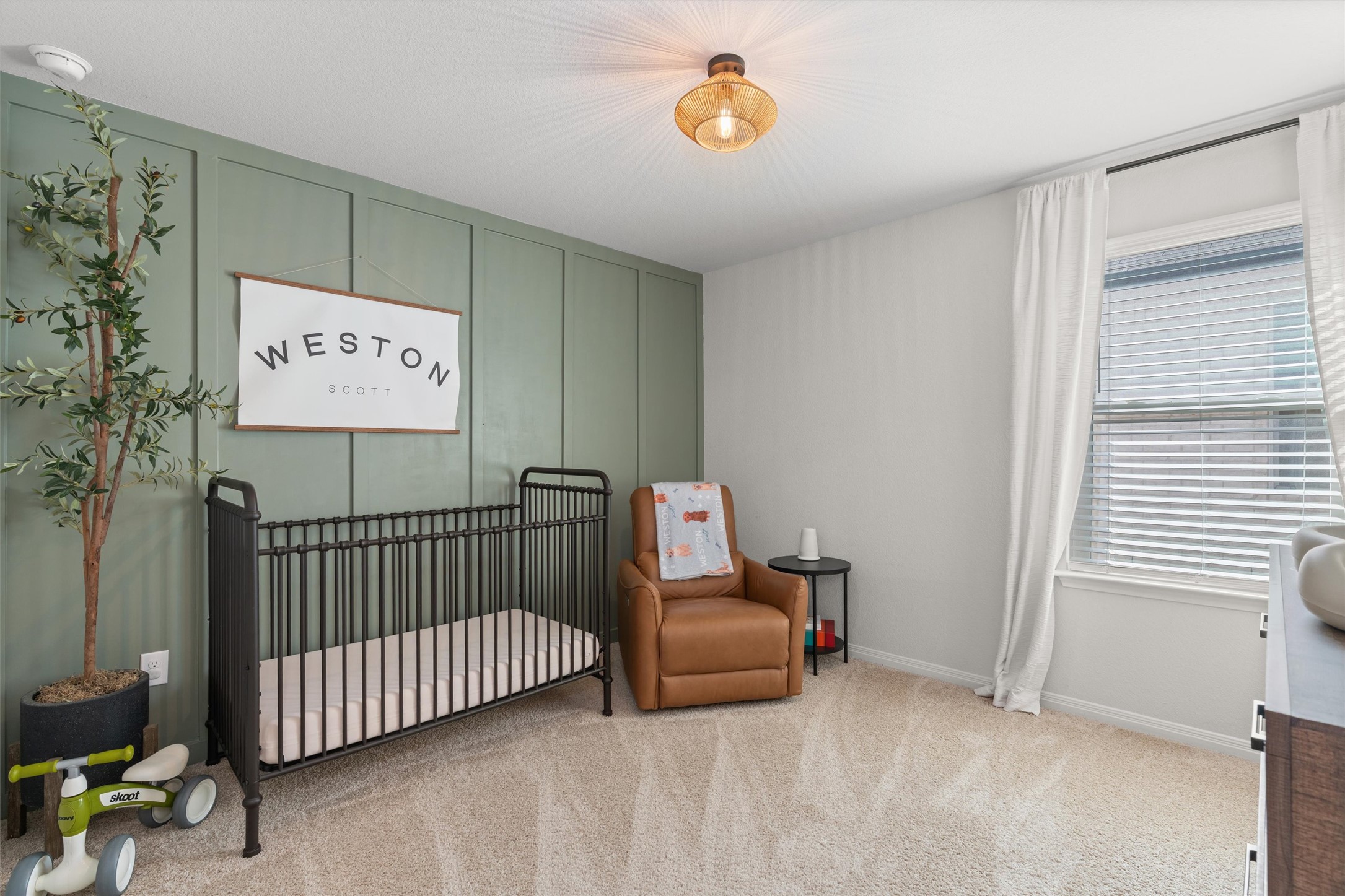 19912 Abigail Fillmore Road Manor, TX 78653 - Photo 17 of 31 Soft carpet and natural light create a serene atmosphere in this welcoming nursery.