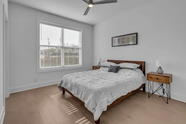 a bedroom with bed and window