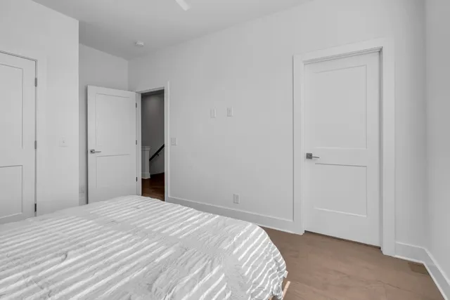 a bedroom with a bed and a bathroom