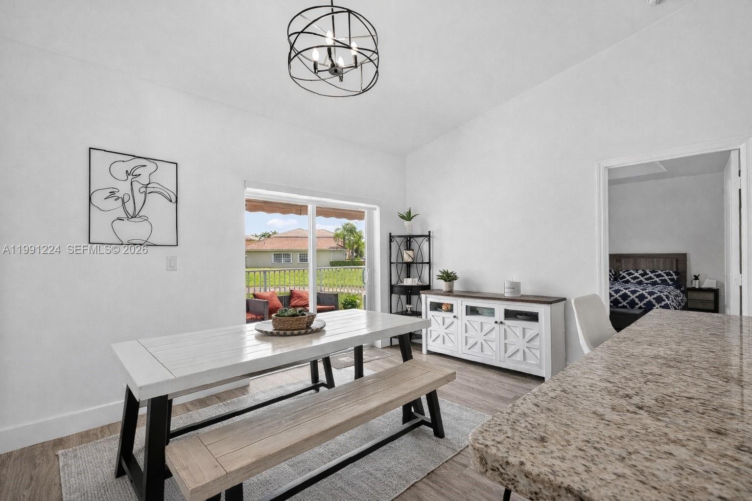 16299 Southwest 103rd Street Miami, FL 33196 - Photo 15 of 30 a bedroom with furniture and a window