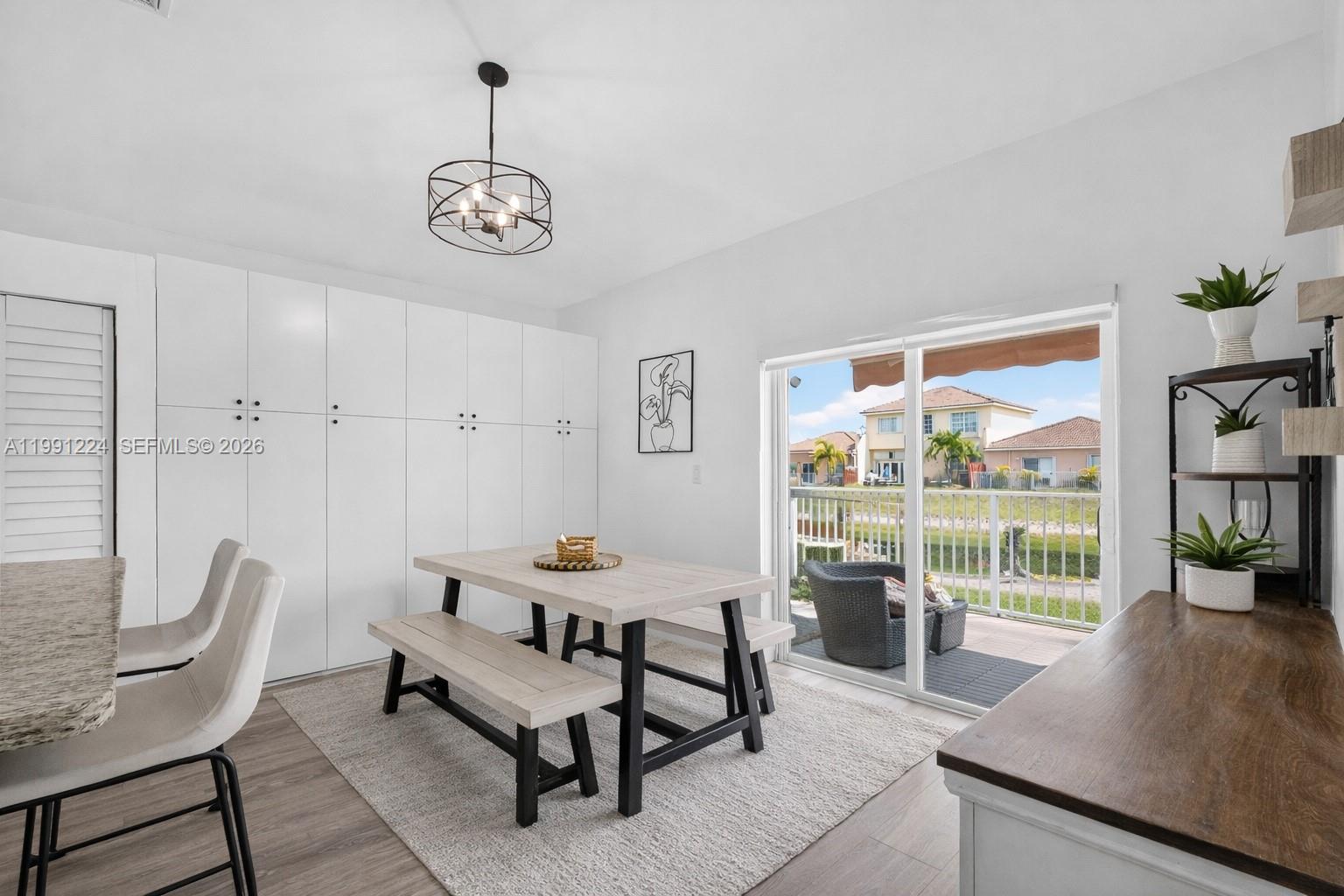 16299 Southwest 103rd Street Miami, FL 33196 - Photo 18 of 30 a dining room with furniture and a window