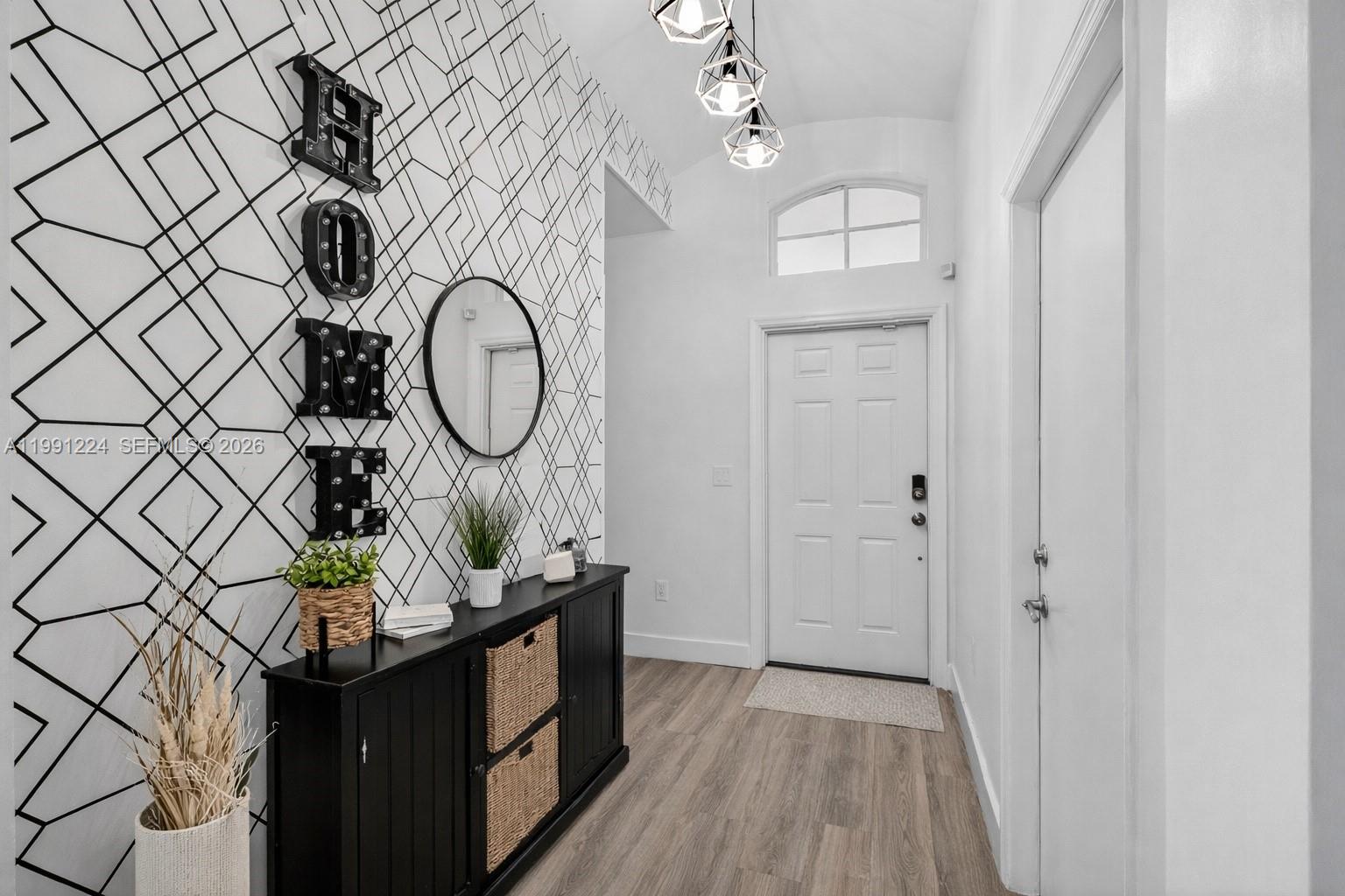 16299 Southwest 103rd Street Miami, FL 33196 - Photo 5 of 30 a view of a hallway with wooden floor