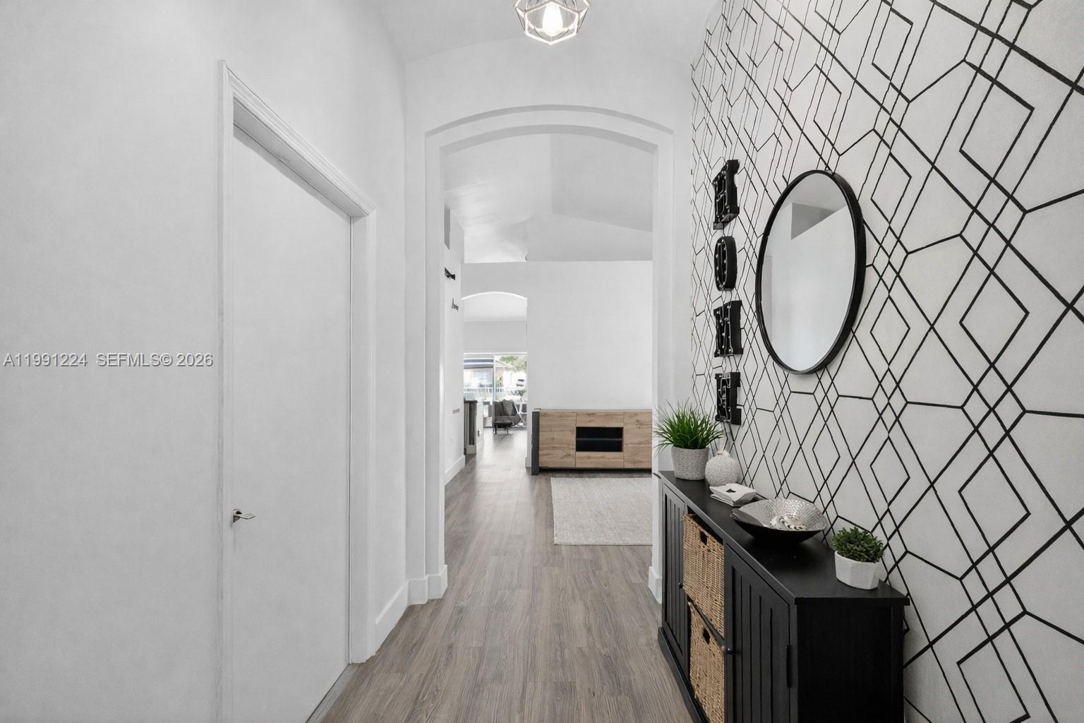 16299 Southwest 103rd Street Miami, FL 33196 - Photo 6 of 30 a view of a hallway with washer and dryer