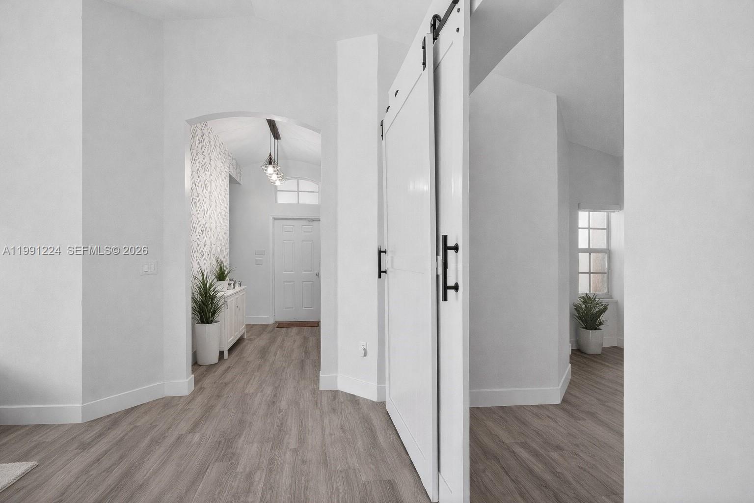 16299 Southwest 103rd Street Miami, FL 33196 - Photo 10 of 30 a view of a hallway with wooden floor