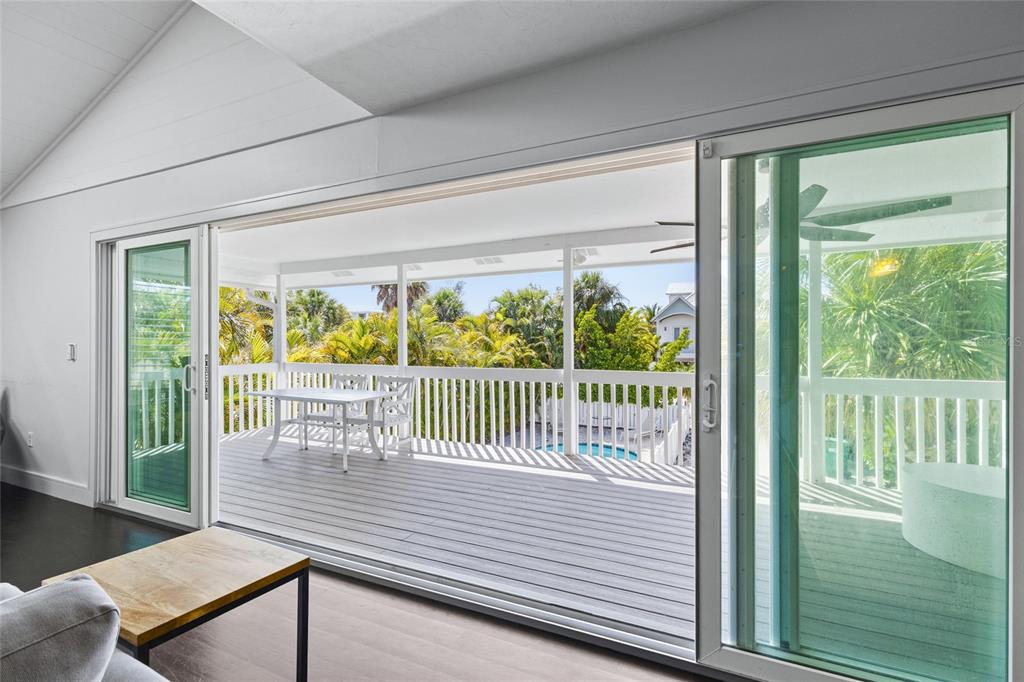 315 Spring Avenue Anna Maria, FL 34216 - Photo 20 of 63 a view of a balcony with wooden floor
