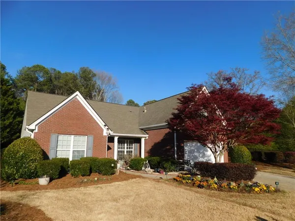 a front view of a house with a yard