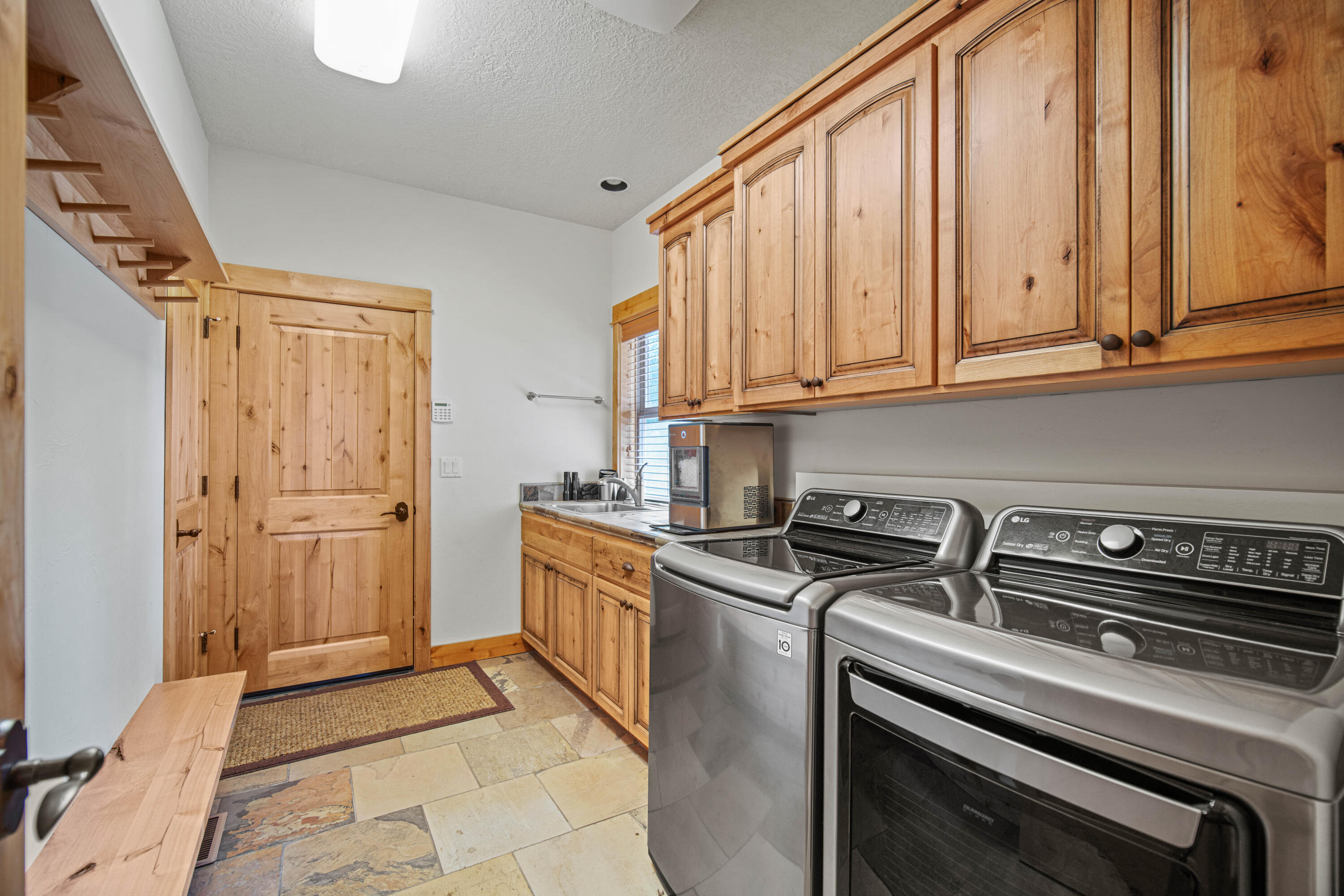 56689 Dancing Rock Loop Bend, OR 97707 - Photo 37 of 51 a kitchen with stainless steel appliances a stove a microwave and a cabinets