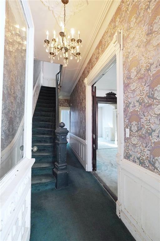 378 8th Street Brooklyn, NY 11215 - Photo 11 of 37 a view of a hallway with windows and chandelier