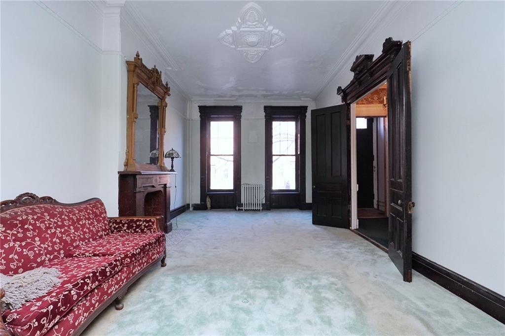 378 8th Street Brooklyn, NY 11215 - Photo 14 of 37 a view of a bedroom with furniture and staircase