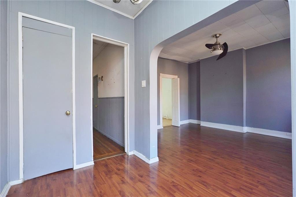 378 8th Street Brooklyn, NY 11215 - Photo 21 of 37 a view of an empty room with wooden floor and a bathroom