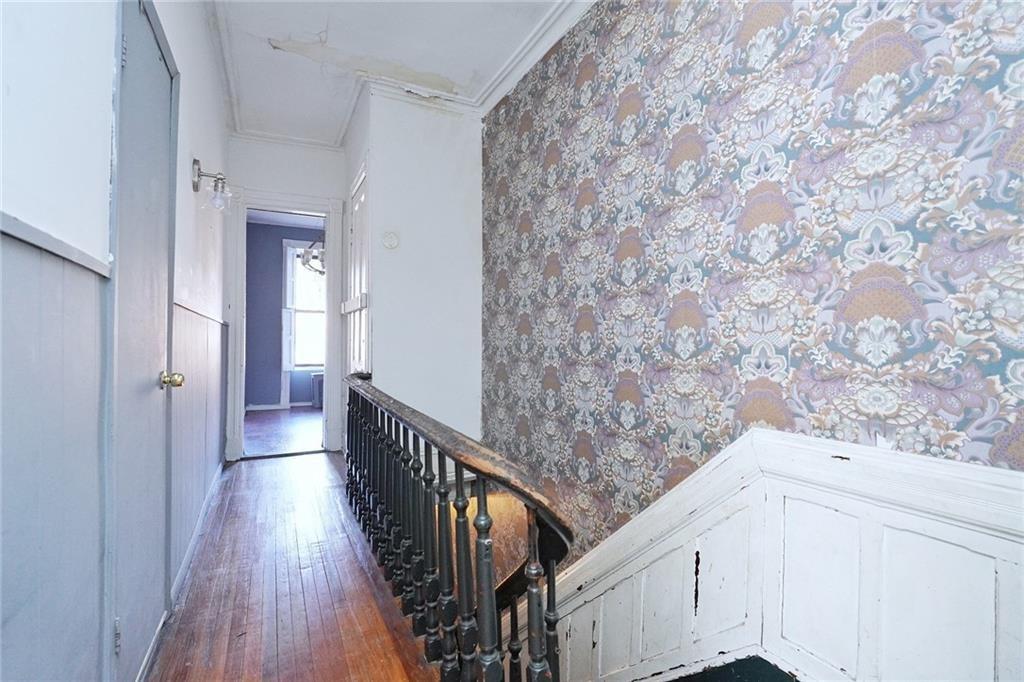378 8th Street Brooklyn, NY 11215 - Photo 28 of 37 a view of a hallway with wooden floor and stairs