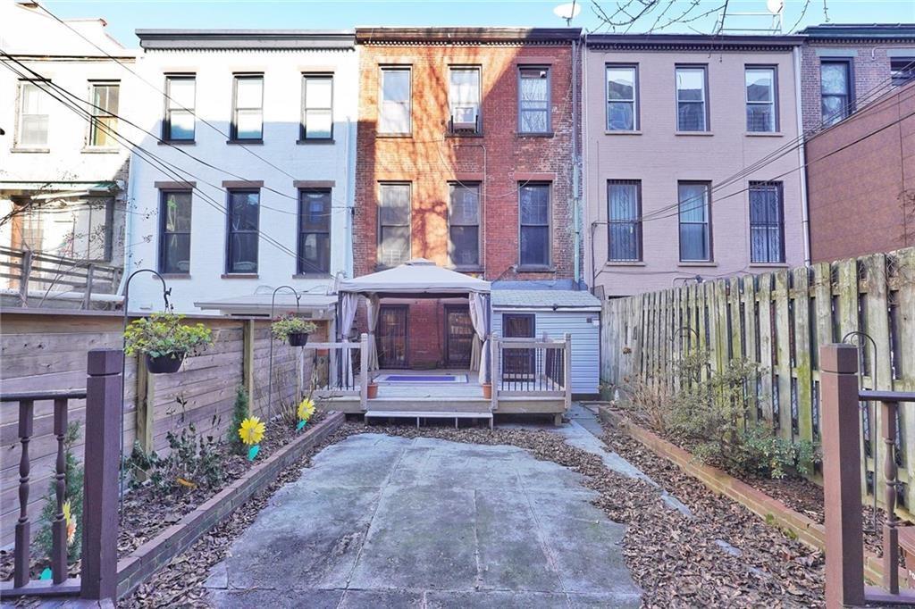 378 8th Street Brooklyn, NY 11215 - Photo 32 of 37 a view of a brick building with a yard in front of it