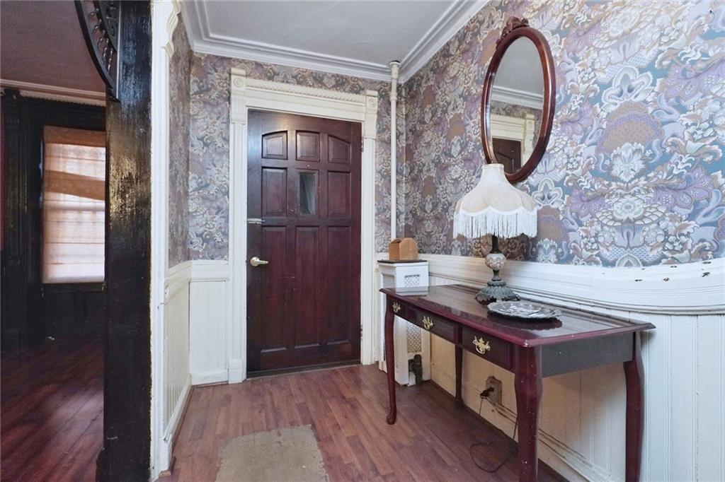 378 8th Street Brooklyn, NY 11215 - Photo 4 of 37 a kitchen with stainless steel appliances granite countertop a stove a sink and a wooden floors