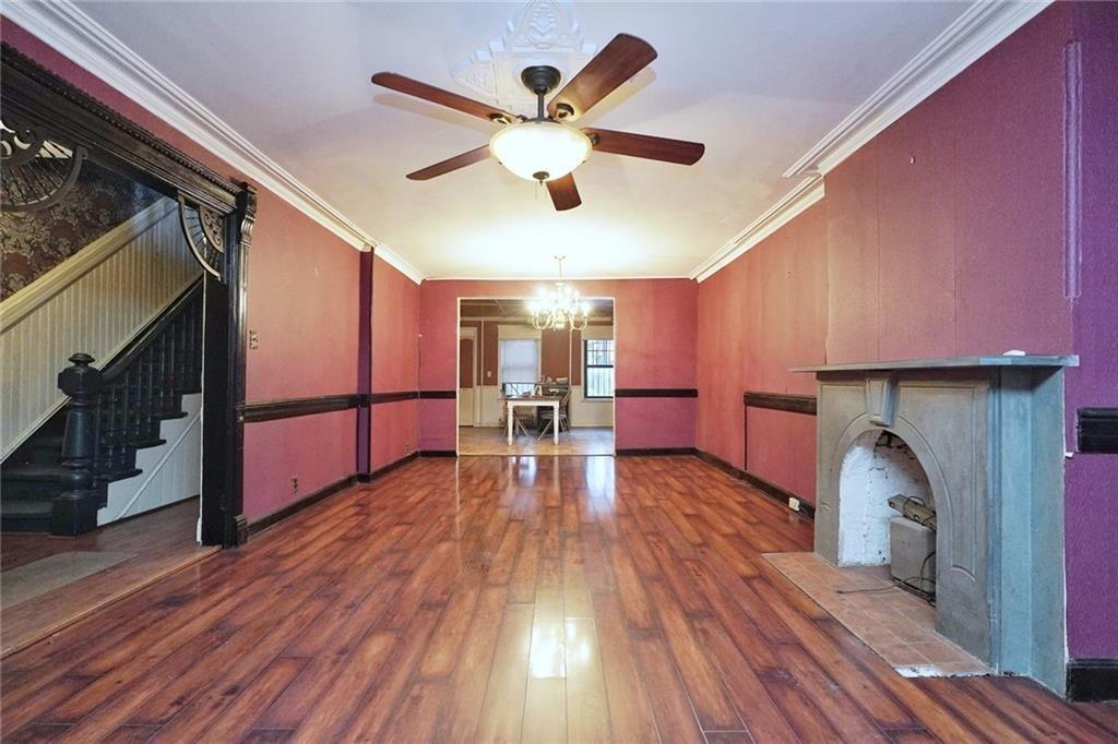 378 8th Street Brooklyn, NY 11215 - Photo 6 of 37 a view of a livingroom with furniture a ceiling fan and wooden floor