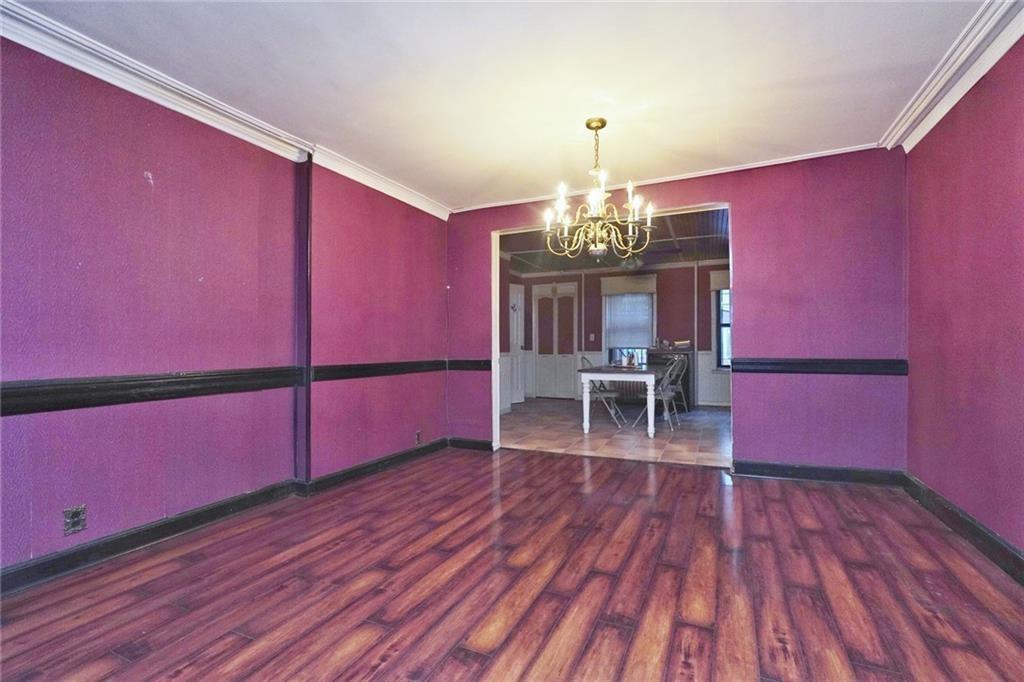 378 8th Street Brooklyn, NY 11215 - Photo 7 of 37 a view of a room with wooden floor and chandelier
