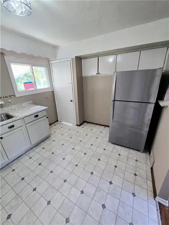 a view of kitchen with furniture and wooden floor