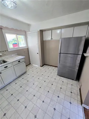 a view of kitchen with furniture and wooden floor